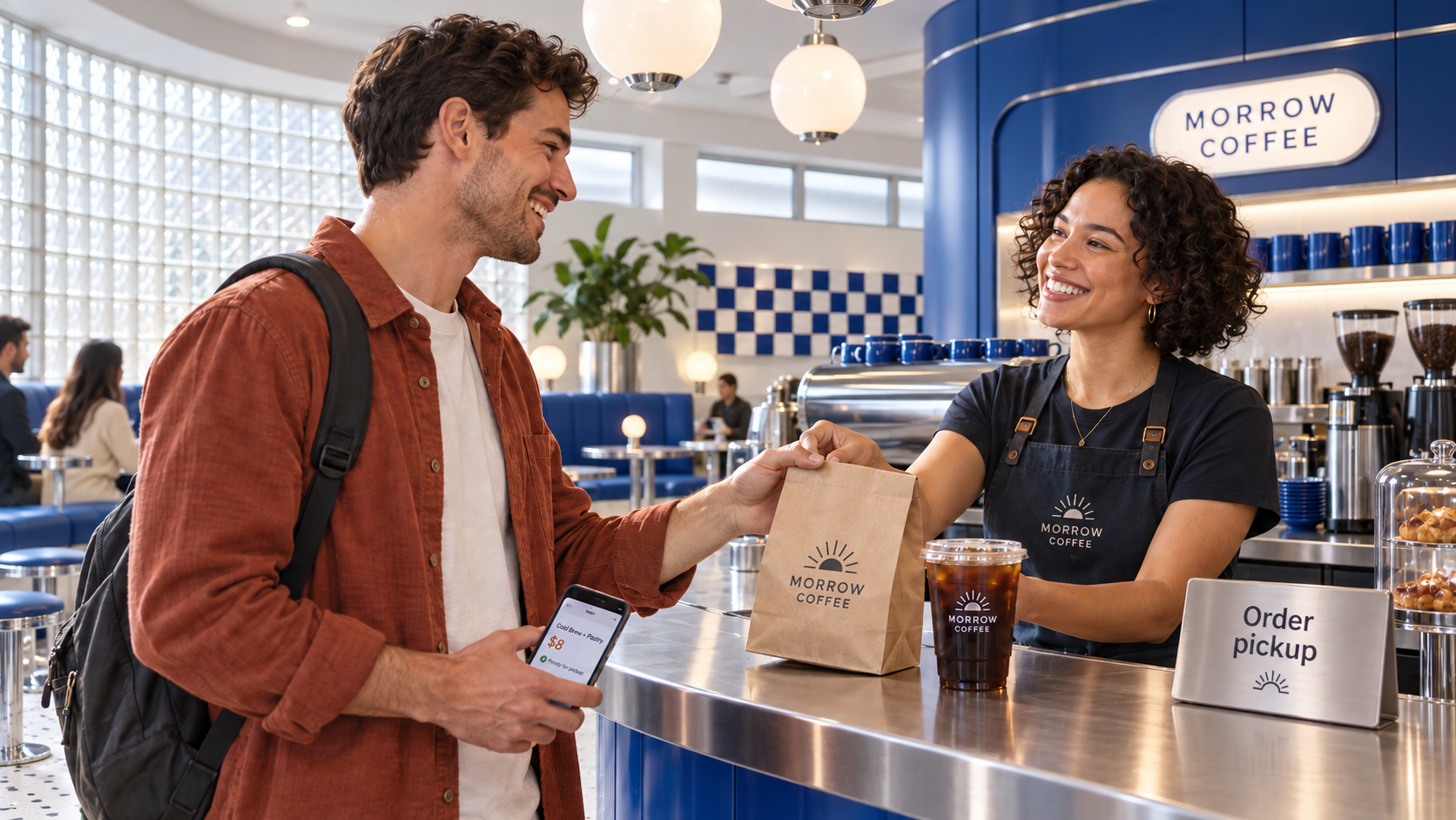 A customer collecting a pickup order at Morrow Coffee