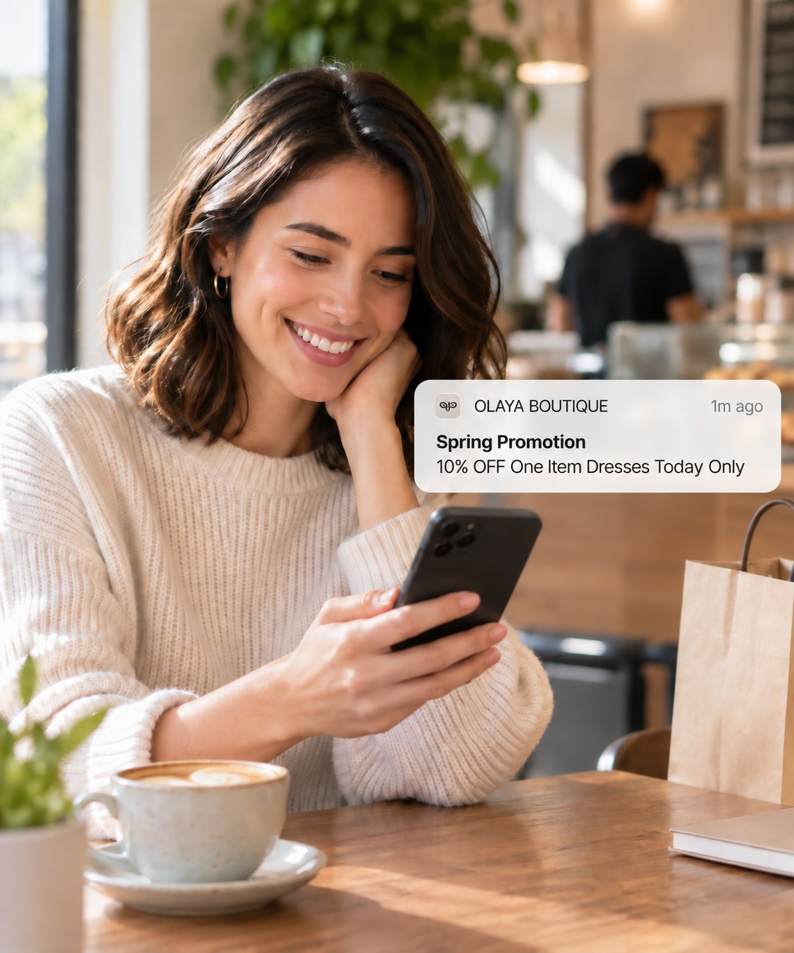A customer smiling at a push notification from her favorite boutique