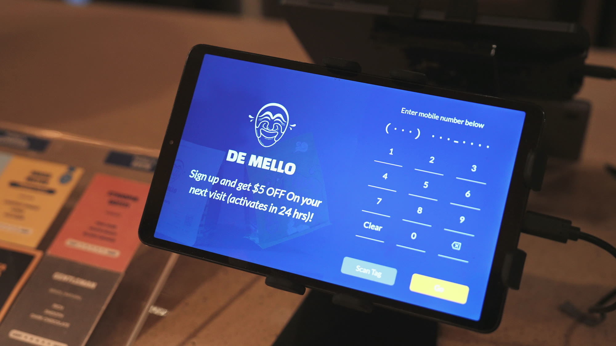 The De Mello sign-up tablet at the counter